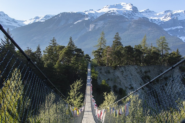 Rope bridge towards mountains in Bhutan