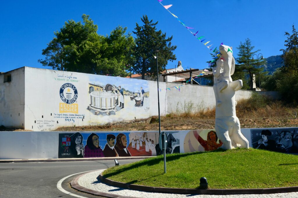 Mural celebrating the largest cheese, Loculi, Sardinia
Copyright © letsexplorehere.com