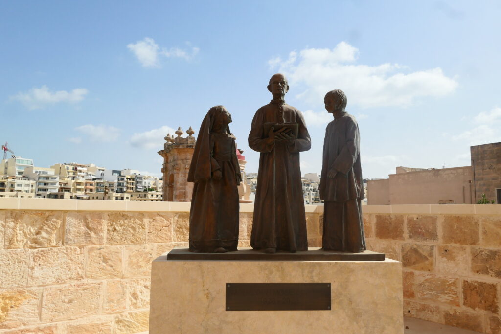 Statue of Dun Moses Debono - a religious teacher in Pjazza Tal- Mellieħa, Malta
Copyright © letsexplorehere.com