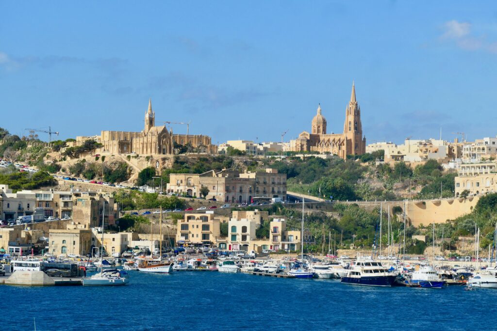 Mgarr harbour with Għajnsielem in the background, Gozo
Copyright © letsexplorehere.com